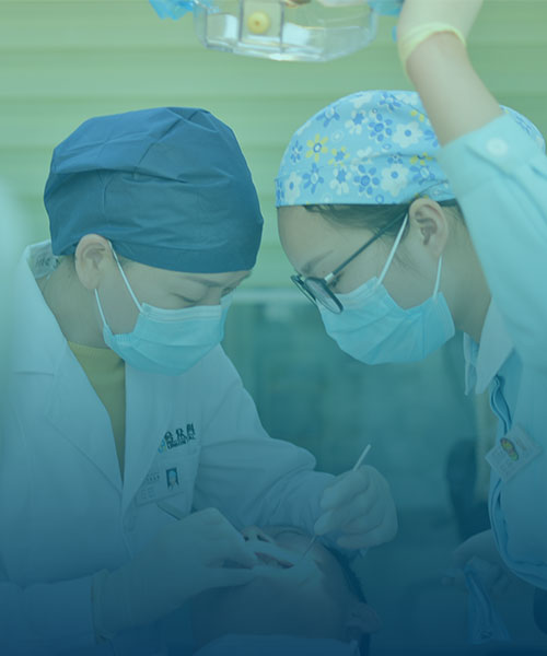 Dental team performing procedure in clinic